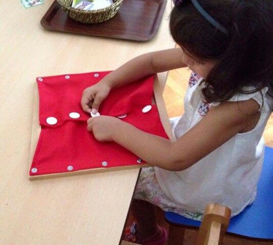 Buttoning Frame with Large Buttons